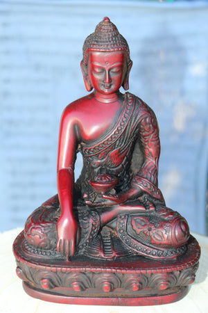 Shakyamuni Buddha statue in burgundy color